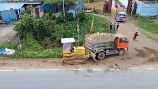 Bulldozer with Dump Truck submerge pushing soil stone part 2