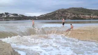 Guys Body Surf when Moore River Bursts its Banks