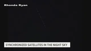 Synchronized satellites: Explaining the straight line of lights in the night sky