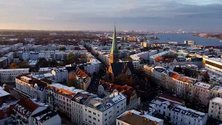 First snow ❄ in Rostock, November sunset in 2022 - Aerial drone 4K