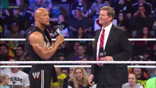 The Rock takes down People Power, delivering a People's Elbow to a returning John Laurinaitis: Smack