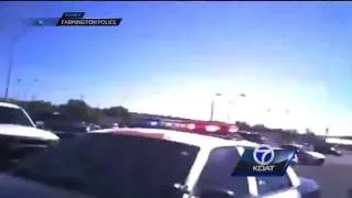 Police officers lift car off of trapped woman