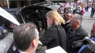 Tom Hamilton of Aerosmith signs for fans outside VH1 in N...