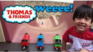 Ryan plays with Thomas and friends toy trains at the Playground