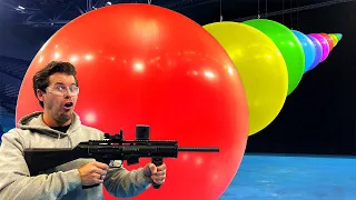 ¿Cuántos Globos GIGANTES Aguantan una BALA de Paintball? [Cámara Lenta]