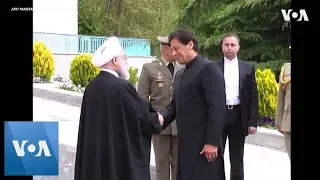 Iran President welcomes Pakistan PM Khan with honor guard