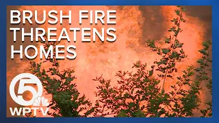 Brush fire breaks out near Stuart West community endangering homes