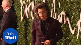 Harry Styles looks sharp in pinstripe suit at fashion awards (archive) - Daily Mail