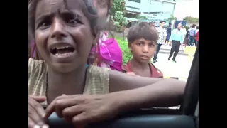 Poor kids in India begging for money