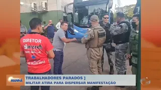 Policial Militar atira no chão para dispersar manifestação em garagem de ônibus