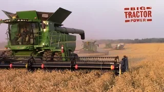 Big John Deere Combines Harvesting Wheat