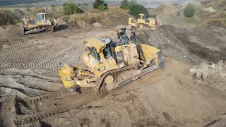 Two Caterpillar D9T Bulldozers And Komatsu D275AX Bulldozer Levelling A Huge Mining Site