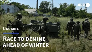 Ukraine team race to clear mines before winter | AFP