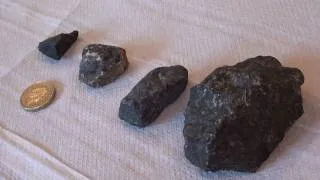 Black magnetic rocks collected at Bramfield, testing with a rare-earth magnet