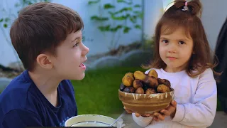 Baked potatoes cooked on the grill in our simple village life with Dumitru family.