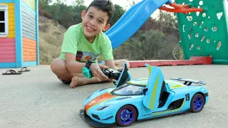 LUCAS E PAPAI BRINCAM DE CARRINHO DE CONTROLE REMOTO