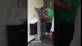 Guy drunk at the atm