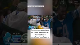 🍺 Packers fan dumps beer on Lions’ Amon-Ra St. Brown after his Lambeau Leap 🏈 | #shorts