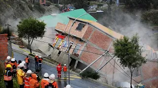 Bolivia: residents watch as landslide sweeps away houses