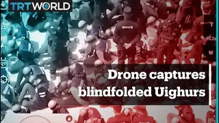 Footage shows Uighurs blindfolded, handcuffed in masses