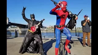 Ukulele Batman Returns to Battle Unicycle Bagpipe Spider-Man in a Theme Song Throw Down!