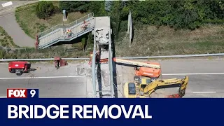 RAW: Pedestrian bridge over Hwy. 62 damaged by truck crash being removed | FOX 9