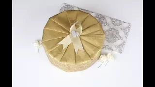 Wrapping a Circular Gift with Golden Garden Wrapping Paper