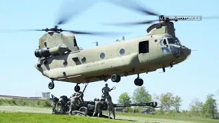 U.S. Armed Forces Army - Sling and Loading CH-47 Chinooks Carry the M777 Howitzers