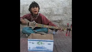 Tibet Young boy singing traditional song in Lhasa