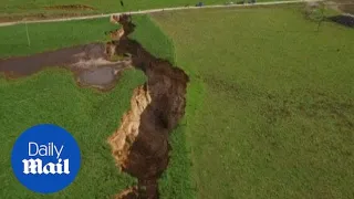 Sinkhole suddenly appears in middle of farmland - Daily Mail