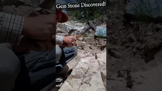 Breaking a Rock to Discover a Beautiful Gemstone.