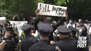 Masked protester taunts NYC Israel Day Parade marchers with vile ‘Kill Hostages Now’ sign