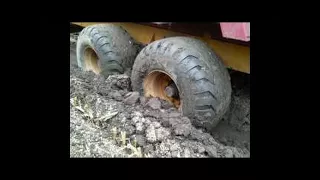 tractor stuck in deep mud, fendt tractor stuck, farming equipment stuck