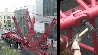 Assembling a large mobile crane that will be used to disassemble a tower crane