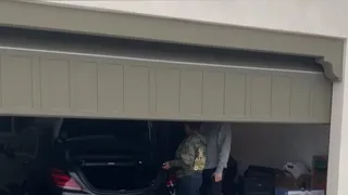 Gary Owen surprises wife with a new Tesla for Christmas.