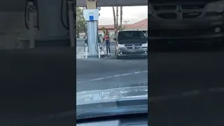 Girl can't find fuel cap at gas station