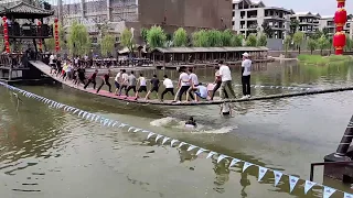 Dancing on the swing bridge? ALL IN THE WATER   