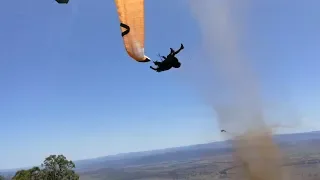 Dust devil sends paraglider flying