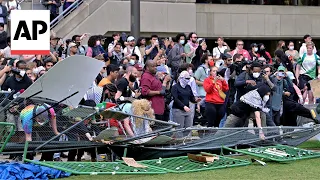 Pro-Palestinian protesters knock down barrier at MIT