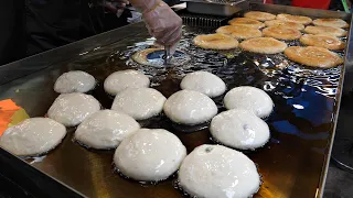 2,000 of the famous Korean pancakes were sold per day. Korean pancake "Hotteok" / Korean street food