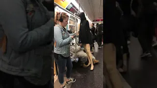 Bum fights mannequin on train