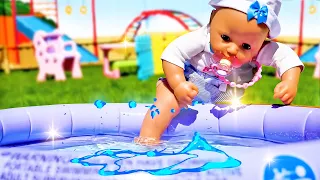 Baby Annabell doll swimming & baby doll plays with toys in the water pool. Swimsuit for baby dolls.