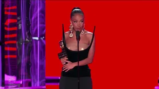 Doja Cat accepting her award for “Top R&B Album” at the Billboard Music Awards.