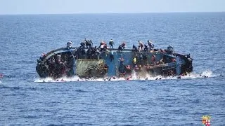 Migrant rescue from capsized boat is caught on camera
