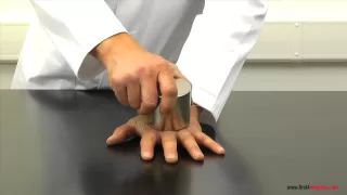 Super-strong neodymium magnets crushing a man's hand