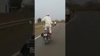 old man dancing on bike