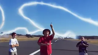 Wingtip Vortices and Smoke Create White Ribbons in the Air