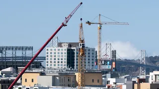 Ironworkers building a tower crane in Berkeley California