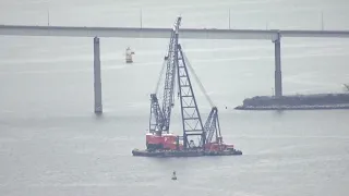 VIDEO | Large crane on site of Baltimore bridge collapse to help remove debris