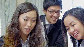 Young Asian business partners in a meeting, discuss their business strategy. Stock Footage